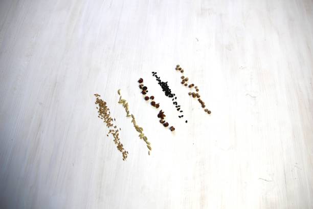istock Heaps of different spice seeds on white wooden background 1392127283