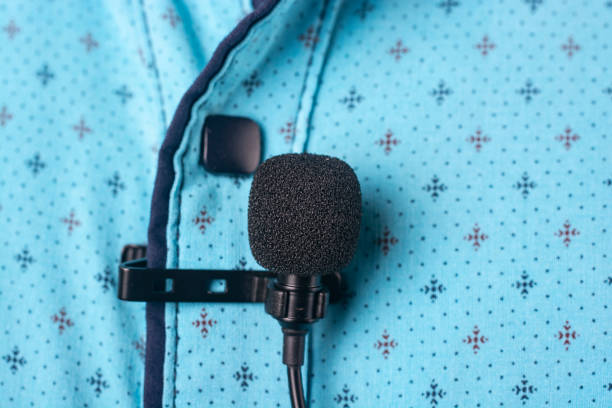 istock Close-up of a microphone attached to a shirt. 1392128631