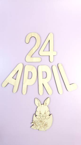 istock Orthodox Easter date - April 24, decorative wooden elements - letters, numbers and Easter Bunny. Easter concept on lilac background, vertical. 1392130890