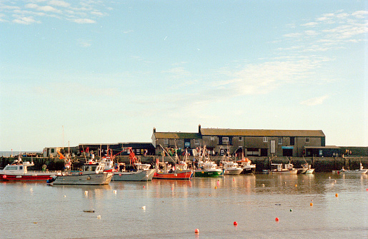 Calm seas and warm summer sunshine in the Dorset port, 35mm film.
