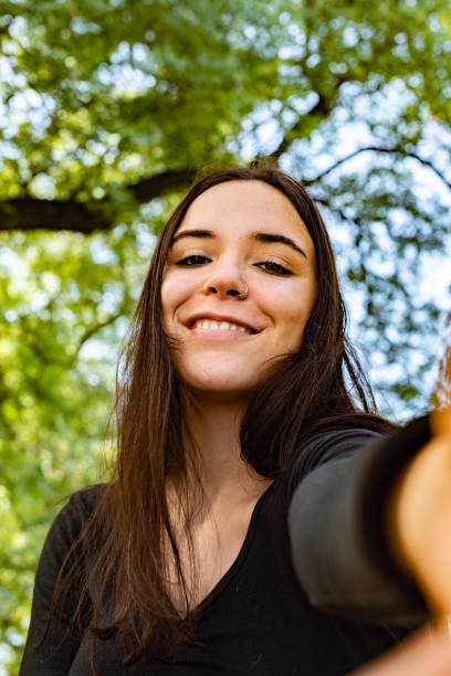 istock A beautiful girl making a selfie smiling in camera 1392133836