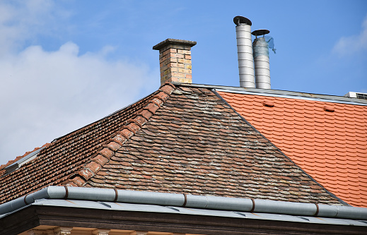 An image of a single vent stack on a residential roof top.
