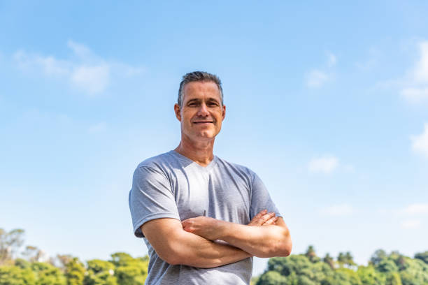 istock A handsome man with his arms folded and looking at the camera 1392134430