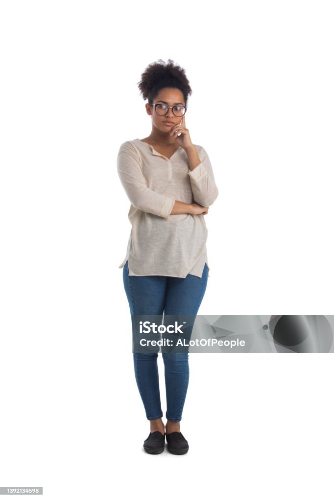 Thoughtful mixed race woman Thoughtful mixed race black woman wearing casual clothes full length portrait isolated over a white background African Ethnicity Stock Photo