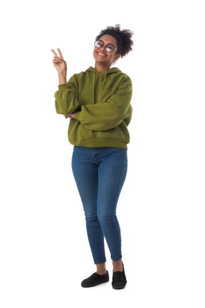 istock Black woman showing v-sign gesture 1392134623