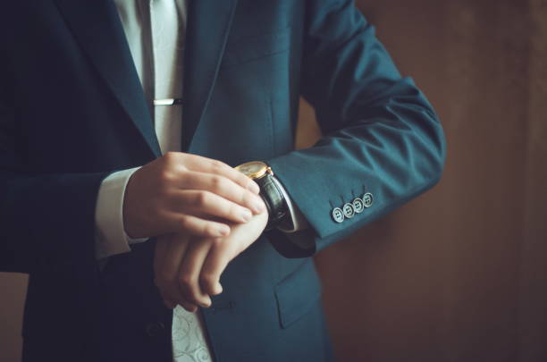 istock Classic watches in their hands 1392135358