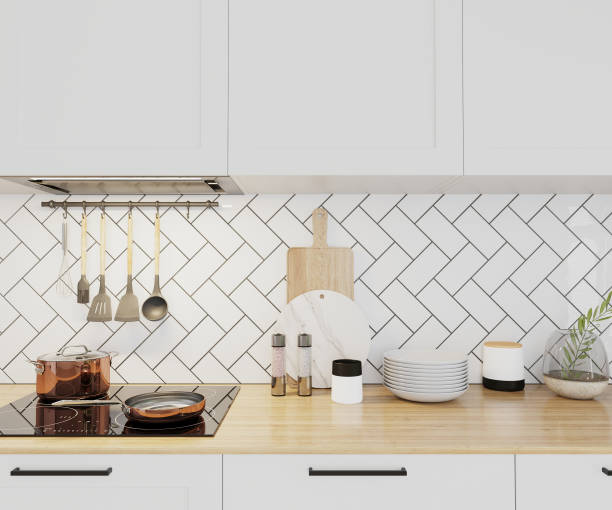 istock white kitchen cabinets with wooden countertop and kitchen utilities, 3d render 1392136790