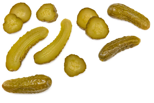 istock marinated pickled cucumbers with slices isolated on white background. Clipping path and full depth of field. Top view 1392138169