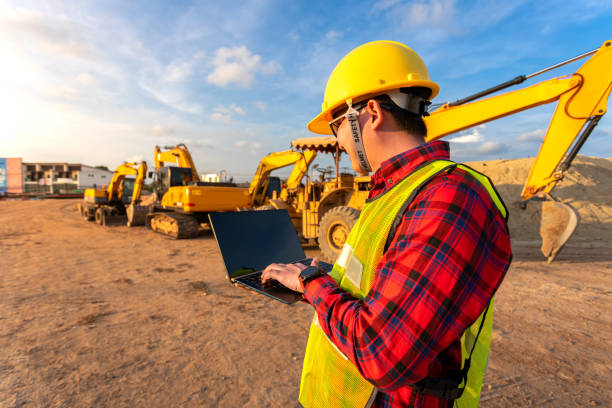 istock asian technician civil engineer use tablet with smart pen technology on transport site construction to inspect blueprint engineering work online with team at sunset time 1392138404