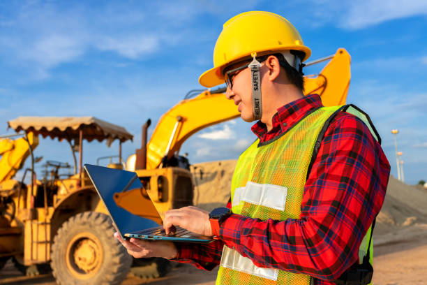 istock asian technician civil engineer use tablet with smart pen technology on transport site construction to inspect blueprint engineering work online with team at sunset time 1392138410