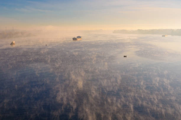 Cargo ship in fog on river Dnieper