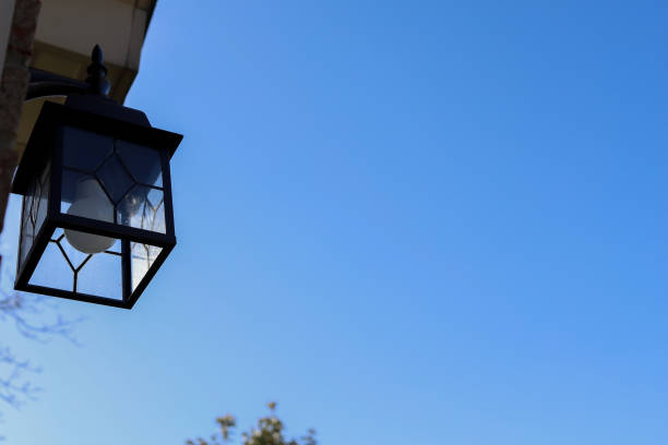istock An exterior light fixture on a wall against a blue sky 1392140499