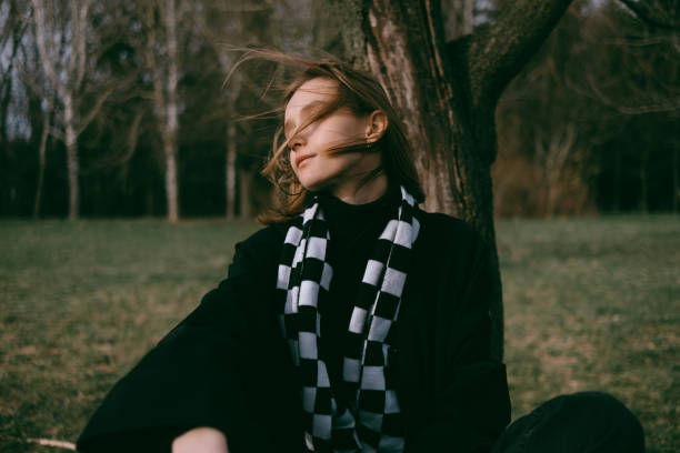 istock the lioness sits in a park on a bench while her hair flutters in the wind. 1392141155