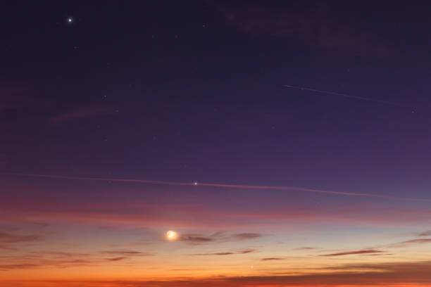 istock Crescent young Moon and planets on colorful sky. 1392141304