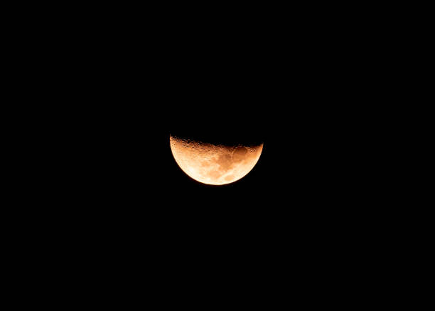 Close-up beautiful texture of half moon during the waxing crescent phase in night sky