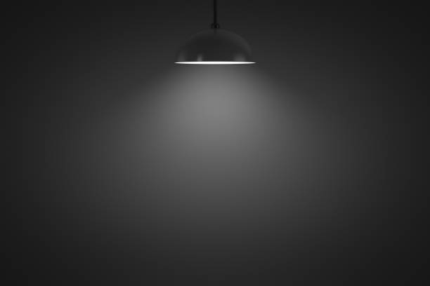 Hanging lamp glows in a dark room Hanging lamp glows in a dark room. Copy space. Design element. darkroom photos stock pictures, royalty-free photos & images