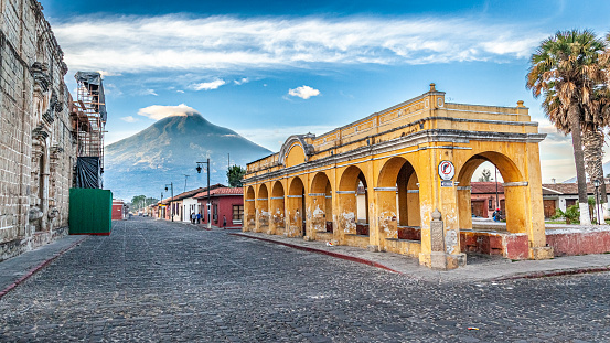 Old public laundry facilities in the beautiful city of Antigua, Guatemala with Spanish Colonial Architecture Yellow Arches in Old City Antigua Guatemala, Unesco World Heritage Site.