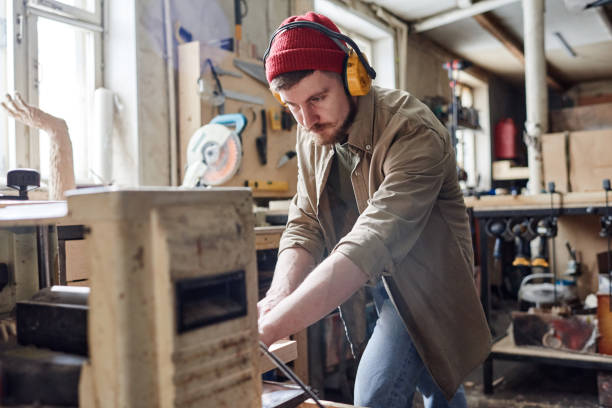 istock Trimming Wood Plank With Thickness Planer 1392147925