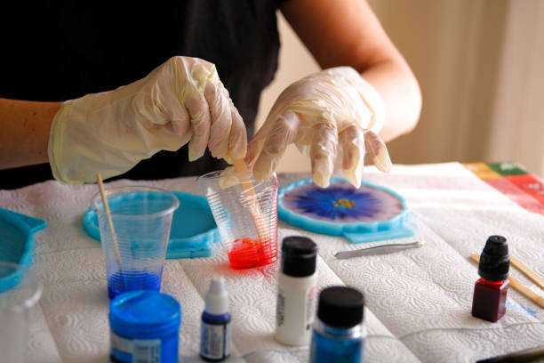 istock Woman making epoxy resin arts and crafts. 1392148080