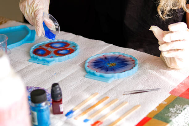 istock Woman making epoxy resin arts and crafts. 1392148083