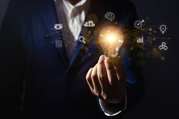 istock Businessman holding light bulb for new idea innovation and inspiration concept with network connection technology. 1392149141