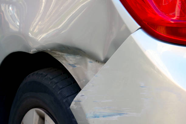istock Broken down car. A small accident with a car. A broken wing or car door. 1392149165