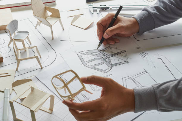 istock Designer sketching drawing design development product plan draft chair armchair Wingback Interior furniture prototype manufacturing production. designer studio concept . 1392149310