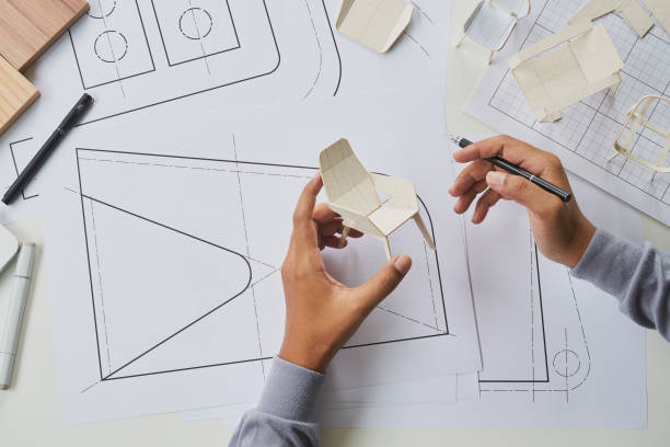 istock Designer sketching drawing design development product plan draft chair armchair Wingback Interior furniture prototype manufacturing production. designer studio concept . 1392149316