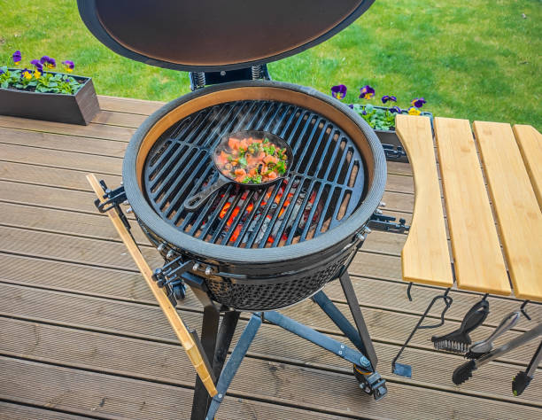 istock Large kamado type barbeque grill with roasted fresh vegetables on a cast iron 1392149759