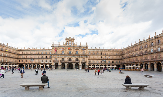 Salamanca, Spain - April 20, 2021: Plaza Mayor of Salamanca Spain. It's the main square of the city and a public gathering place where families and friends come to hang out.