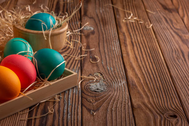 istock Colorful easter eggs on hay. Bright and colorful eggs. Copyspace 1392150710