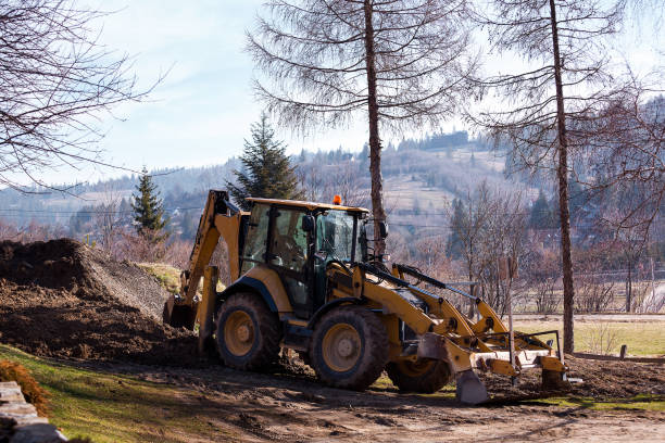 istock Wheel excavator loader is digging the soil at the construction site. 1392159894