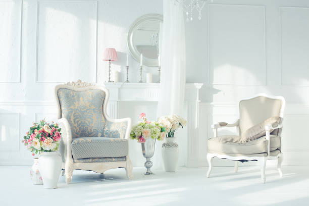 Cozy loft with old fashionned table and sofa against white wall
