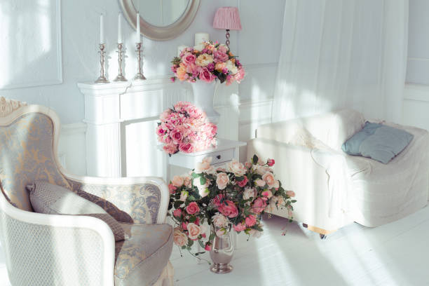 istock luxury clean bright white interior. a spacious room with sunlight and flowers in vases 1392160036