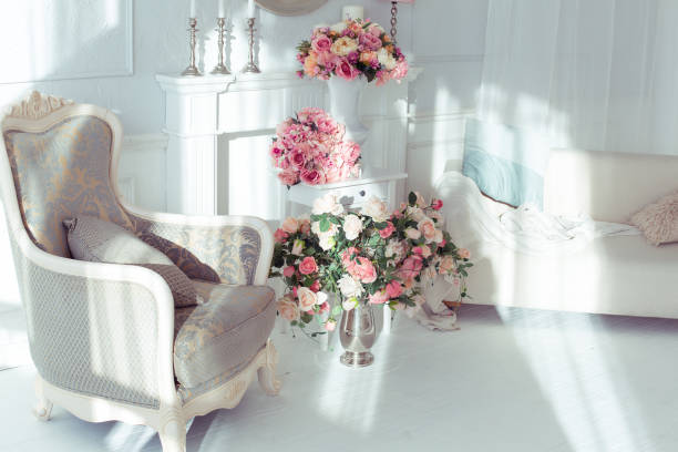 istock luxury clean bright white interior. a spacious room with sunlight and flowers in vases 1392160055