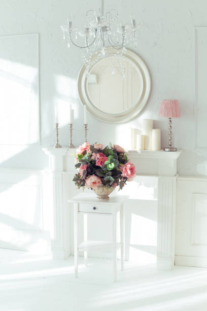 istock luxury clean bright white interior. a spacious room with sunlight and flowers in vases 1392160115
