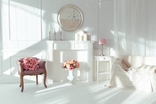 istock luxury clean bright white interior. a spacious room with sunlight and flowers in vases 1392160163