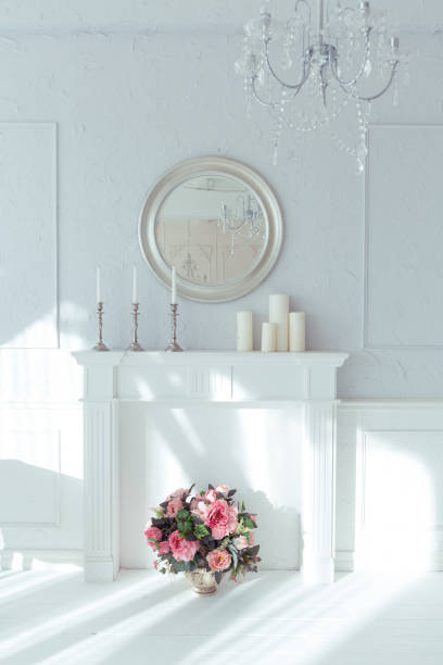 istock luxury clean bright white interior. a spacious room with sunlight and flowers in vases 1392160231