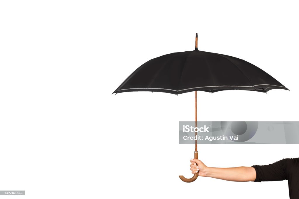 Woman hand holding a black umbrella on a white background Woman hand holding a black umbrella on a white background with copy space Umbrella Stock Photo
