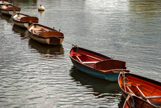 istock Wooden boats on river Thames 1392163344