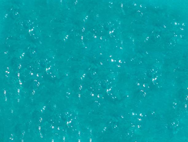 istock abstraction, ripples on turquoise water background,  space for text 1392166240