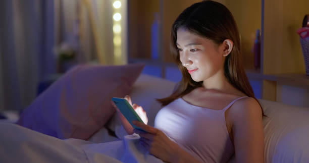istock woman use smartphone on bed 1392166601