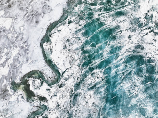 istock Frozen river. Icy snowy background. Aerial view 1392170258