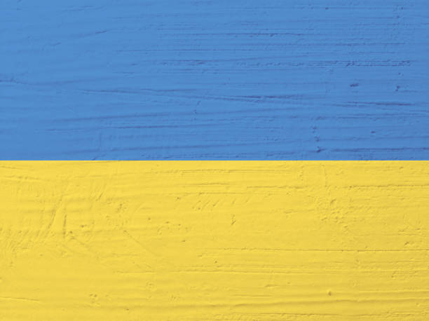 istock Old grunge plastering wall with blue and yellow collors 1392170355