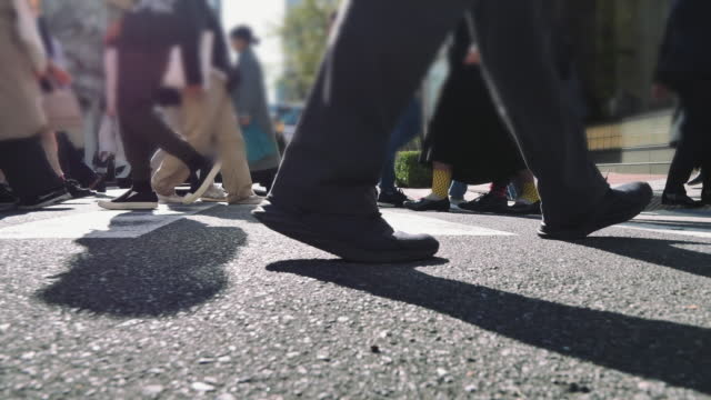 Leg People walking on the crosswalk