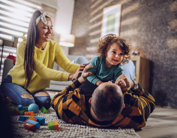 istock happy dad and mom with cute baby boy having fun 1392170737