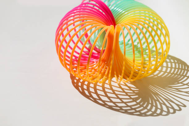 istock Toy plastic colorful rainbow spiral, antistress concept. 1392174894