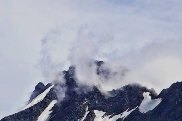 istock Aerial view on snow covered mountains 1392177183