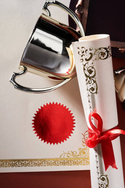 istock blank certificate and gold trophy with ribbon 1392179942