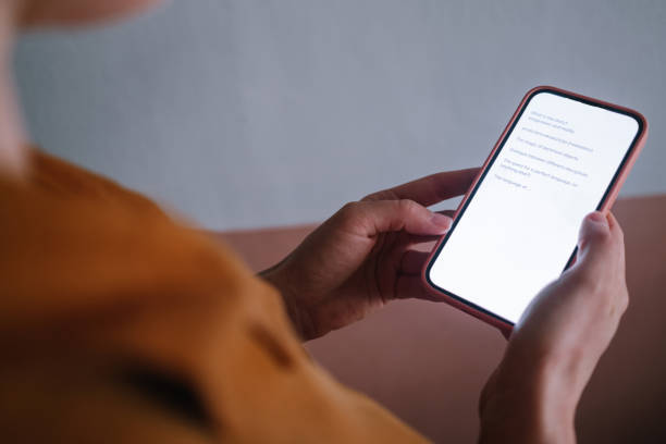 istock Anonymous Woman Reading On Her Phone 1392180231